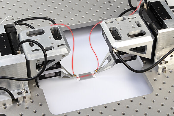 Aligning the inputs and outputs of waveguide devices at an industrial pace requires parallel optimisation and nanoscale accuracy.